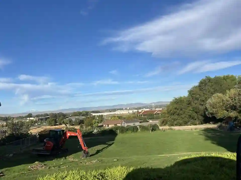 Our excavator working a lawn above the Yakima Valley