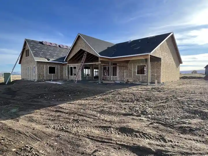 Roofed, sheathed home with its gables standing